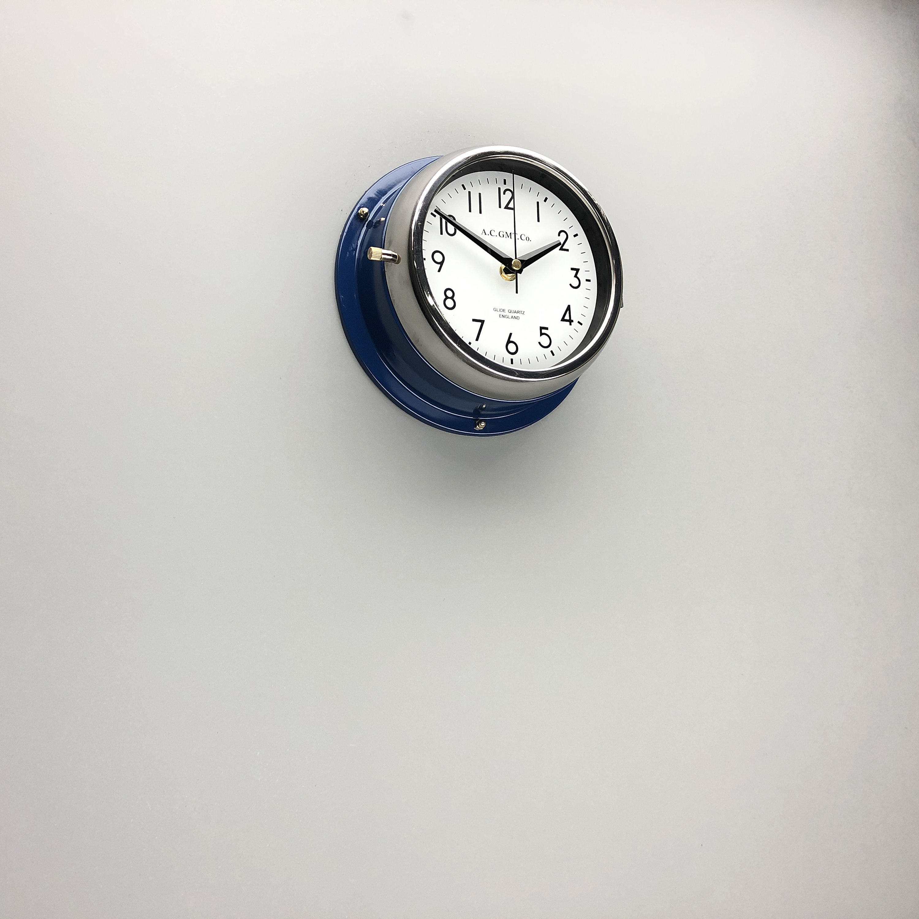 blue clock with white dial